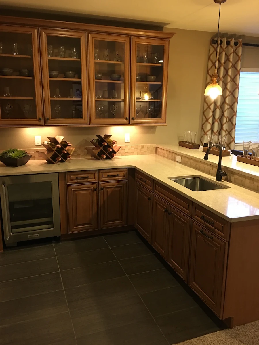 Kitchen with warm wood cabinets and stone counters